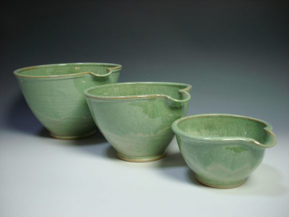 Set of three green ceramic nestling mixing bowls