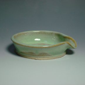 green ceramic spoon rest