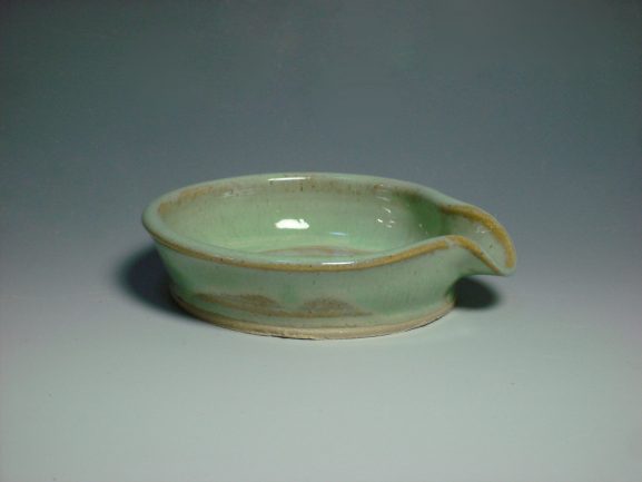 green ceramic spoon rest